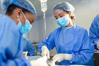 A diverse group of women in surgical gear collaborates on a patient, highlighting their vital role in healthcare industry.